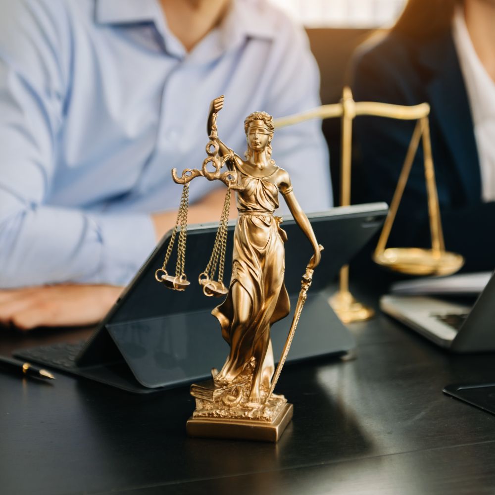 Solicitors reviewing immigration documents with clients